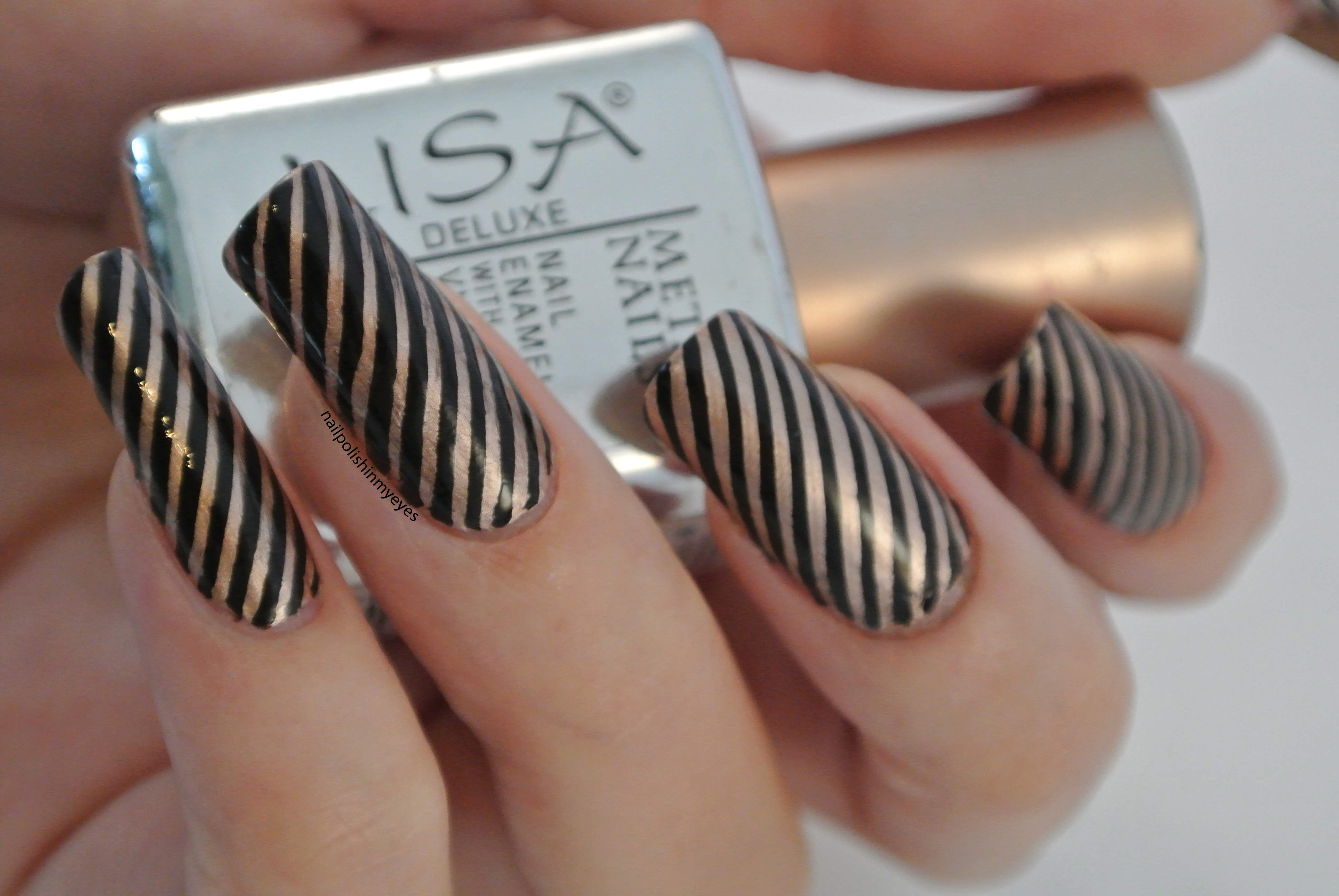 black and gold stripes nail design